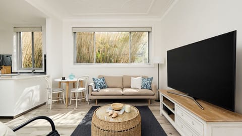 Discover our meticulously curated North Bondi retreat, blending warm tones and natural finishes for a coastal-inspired haven