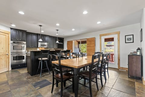 Bear Hollow Village 5595: Dining Area: "Chic dining table with sleek bar stools on a glossy table top."