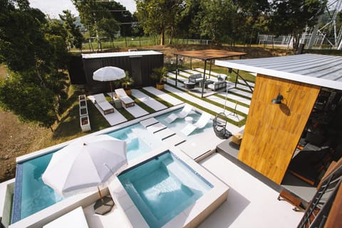 Infinity pool with waterfall, heated jacuzzi, fire pit area. *non- heated pool*