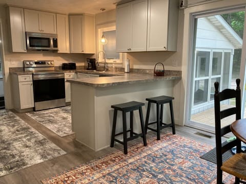 Full Kitchen with full sized new appliances and fully stocked with essentials