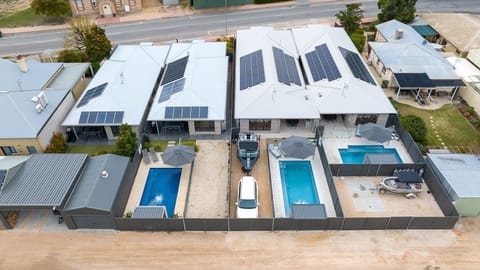 Rear of 48, 50, 52 and 54 Villas showing rear laneway access for second car and/or boat