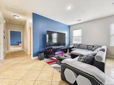 2nd Floor Living Room with 85" 4K TV, Dolby Surround Sound System, & Fireplace