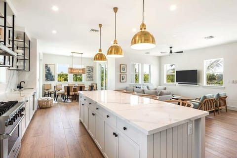 Gourmet kitchen with Keurig coffee machine, lots of cookware, and enough dishes and utensils for everyone