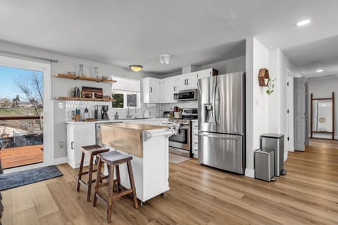 Center island that folds open for added dining space.