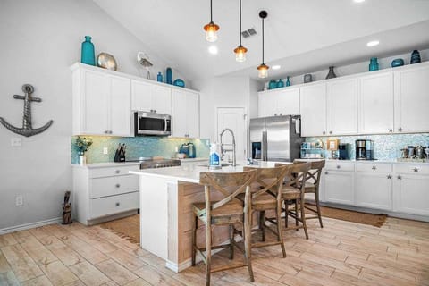 Experience culinary excellence in our modern kitchen, complete with a spacious pantry for all your storage needs.