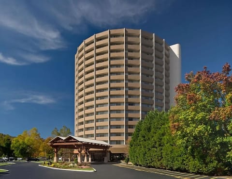 Picture your stay at this landmark tower near mountain scenery.
