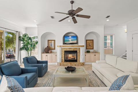 Your elegant living room awaits with plush seating, a cozy fireplace, and entertainment center for perfect relaxation.
