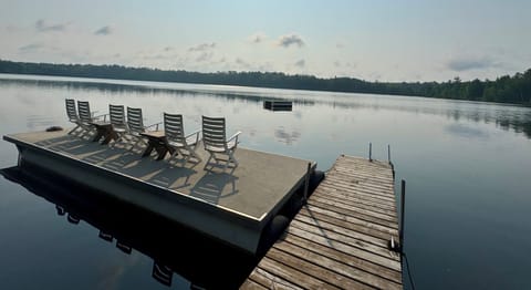 Dock seating with ladder at the end of dock to swim to diving raft. 