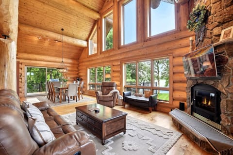 Beautiful real log constructions with massive windows overlooking the lake