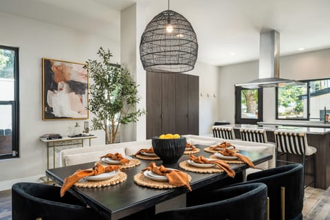 8 person dining table with cozy wrap around dining banquette for nights in.