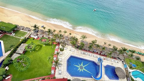 Huge pool with slide and large garden. with beach club with exclusive use cabins