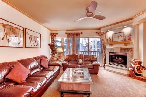 Kick back and relax on the plush sofas featured in the warm and inviting living space