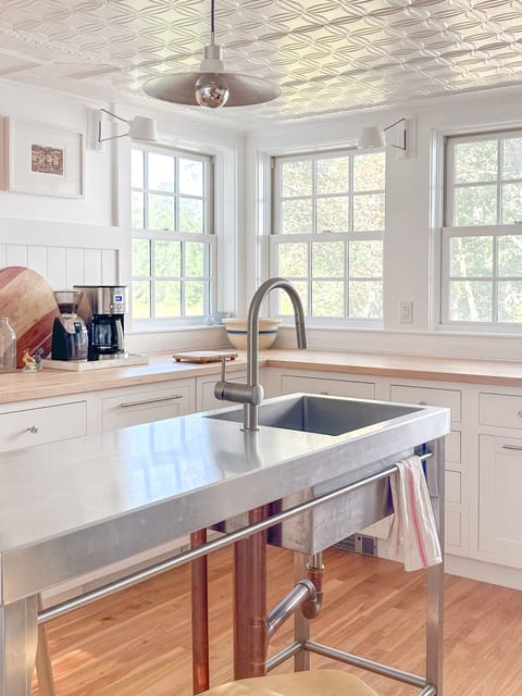 Custom sink island with seating for three.