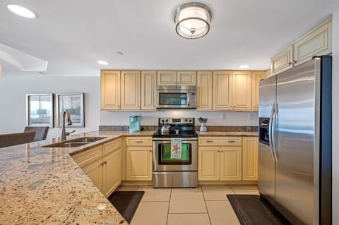 Fully equipped kitchen with granite countertops, stainless steel appliances, Keurig