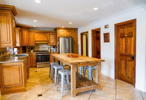 [Kitchen] The Color Scheme in the Kitchen is Warm and Inviting with a Combination of the Natural Light from the Outdoors. 