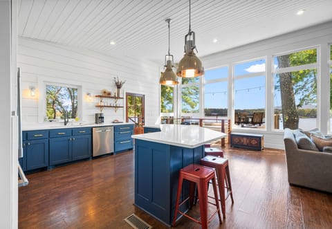 Bright kitchen corner with blue cabinets and sleek finishes to cook in style.