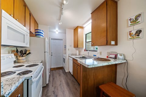 breakfast counter separates kitchen and dining area 
