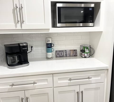 The coffee station is a convenient spot to brew and enjoy your favorite cup.