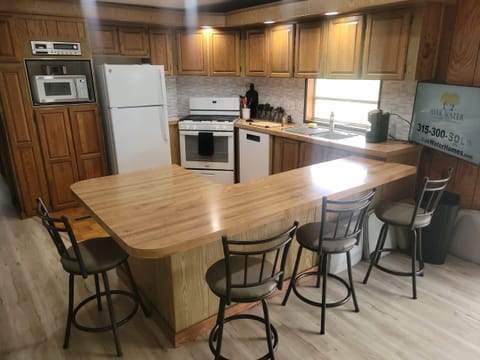 Kitchen and counter with bar stools