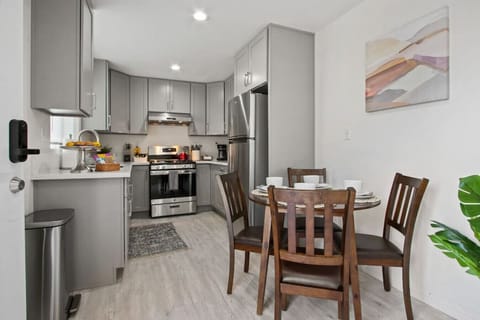 Savor your home-cooked meals at our dining table, which can accommodate up to four guests.