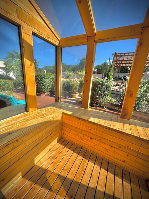 6 person cedar sauna with a view to warm, heal and soothe.