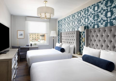 Stretch out after exploring, enjoying crisp linens and city views.