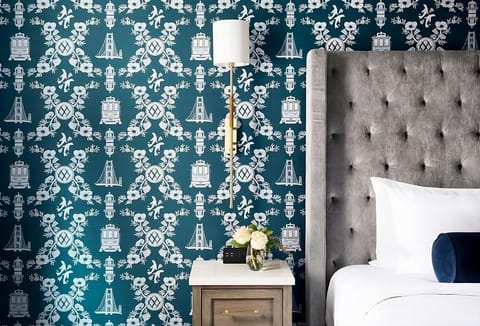 Sink into a velvet headboard backdrop with cozy bedside lighting.
