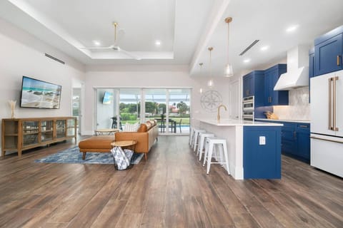 Immediately inside the door, your eyes in be drawn dazzled by the sparkling finishes and drawn outdoors toward the glistening pool.