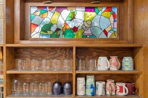 Check out our incredible indoor shelf filled with a unique collection of mugs and glasses!