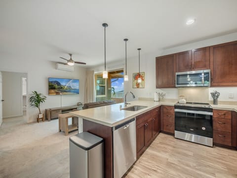 Fully equipped kitchen with all appliances, dinnerware, silverware, kitchen utensils, and cooking pans/pots.