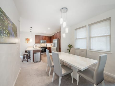 Dining area with premium dining table, 6 chairs and crystal chandeliers.