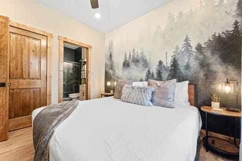 Discover the ultimate escape in our master king suite on the main level. 