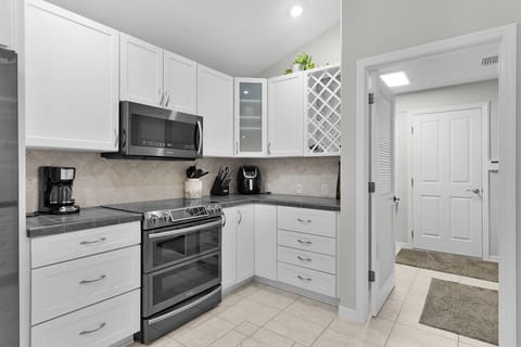 Your fully equipped kitchen awaits with modern appliances, ample storage, and everything needed to prepare memorable meals during your stay.