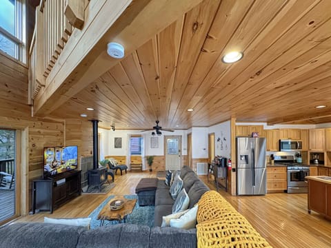 Living Room: Stylish wood accents and ample seating invite relaxation and fun gatherings!