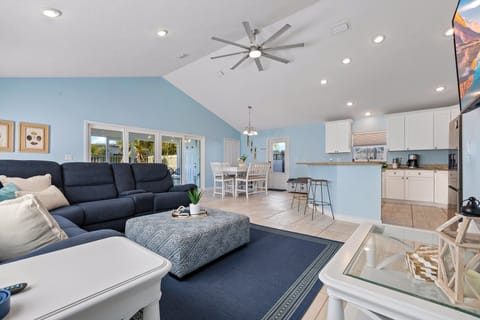 Unwind in a cozy living area and easy access to the kitchen and dining space for ultimate comfort.