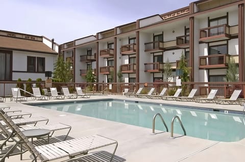 Soak up the sun beside the sparkling pool and loungers.