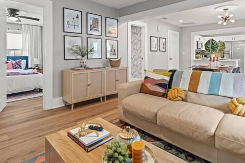 Just off the living area is the first guest bedroom and full bath