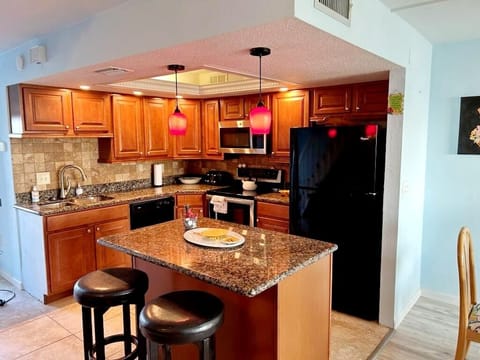 Spacious gourmet kitchen stocked with all cooking necessities