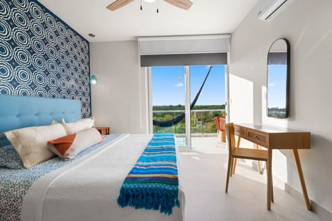 wake up to the sounds of the jungle! king main room with balcony