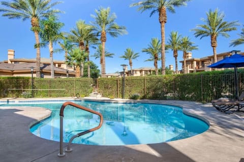 Slip into tranquil waters surrounded by tall palms and sunshine.