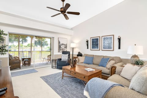 Gorgeous golf-course view over the lake and 16th fairway from the living room.
