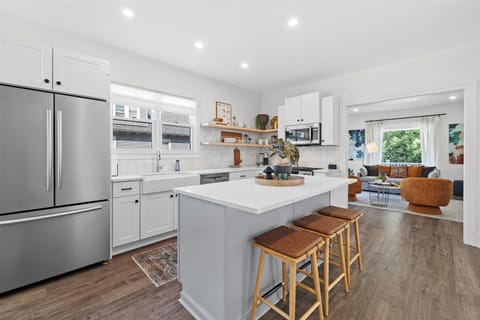 Fully stocked kitchen with counter seating and built in breakfast nook