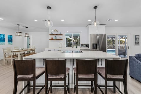 Large center island and stools for additional seating.