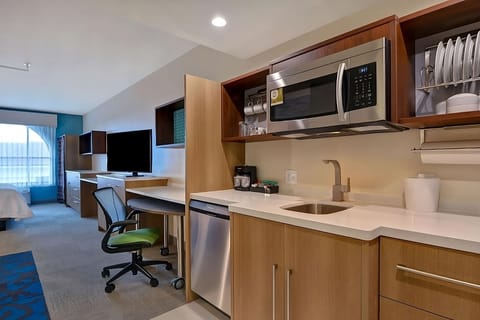 Recharge with easy snacks and coffee from your in-room kitchenette.