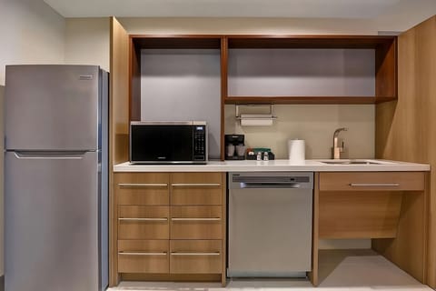 Prepare easy meals with full-size fridge, microwave, and dishwasher.