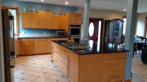 5-burner cooktop in the oversized kitchen.