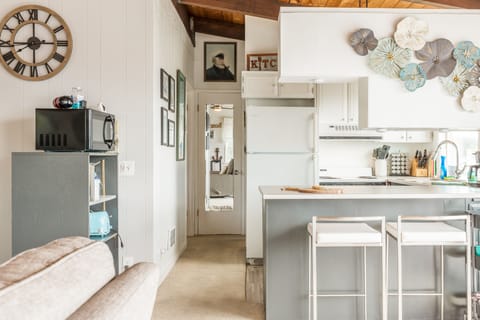 Additional barstool seating at the kitchen counter.