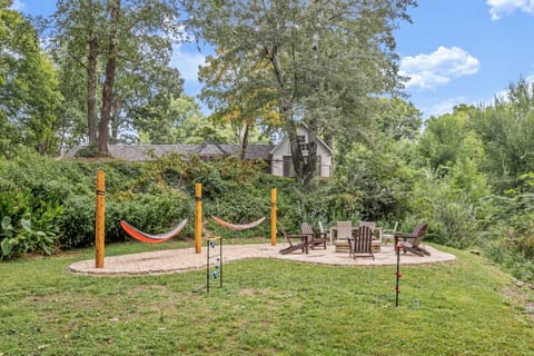Outside is BEAUTIFUL with a one-acre yard perfect for al fresco dining, a night around the firepit, chilling in the hammocks or enjoying a few yard games.