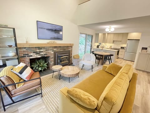 Living room space with Frame TV and gas fireplace