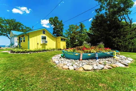 Rowboat with flowers in front of Lemon Drop Cottage